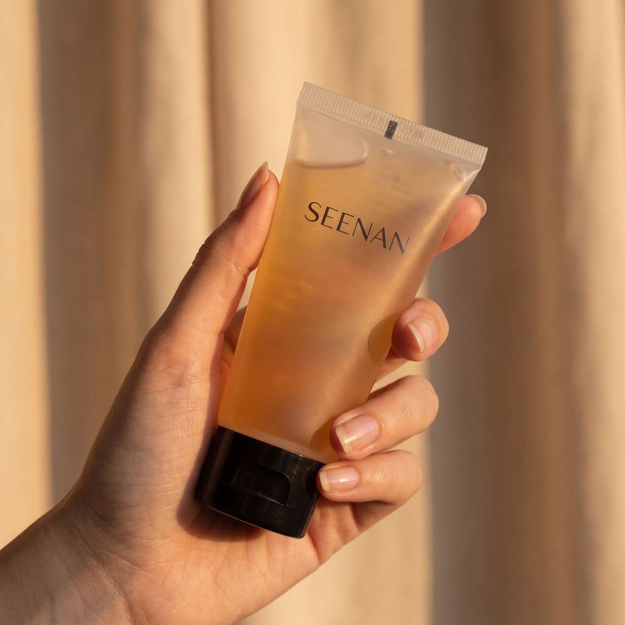Hand holding a Seenan-branded product, candid UGC-style lifestyle shot